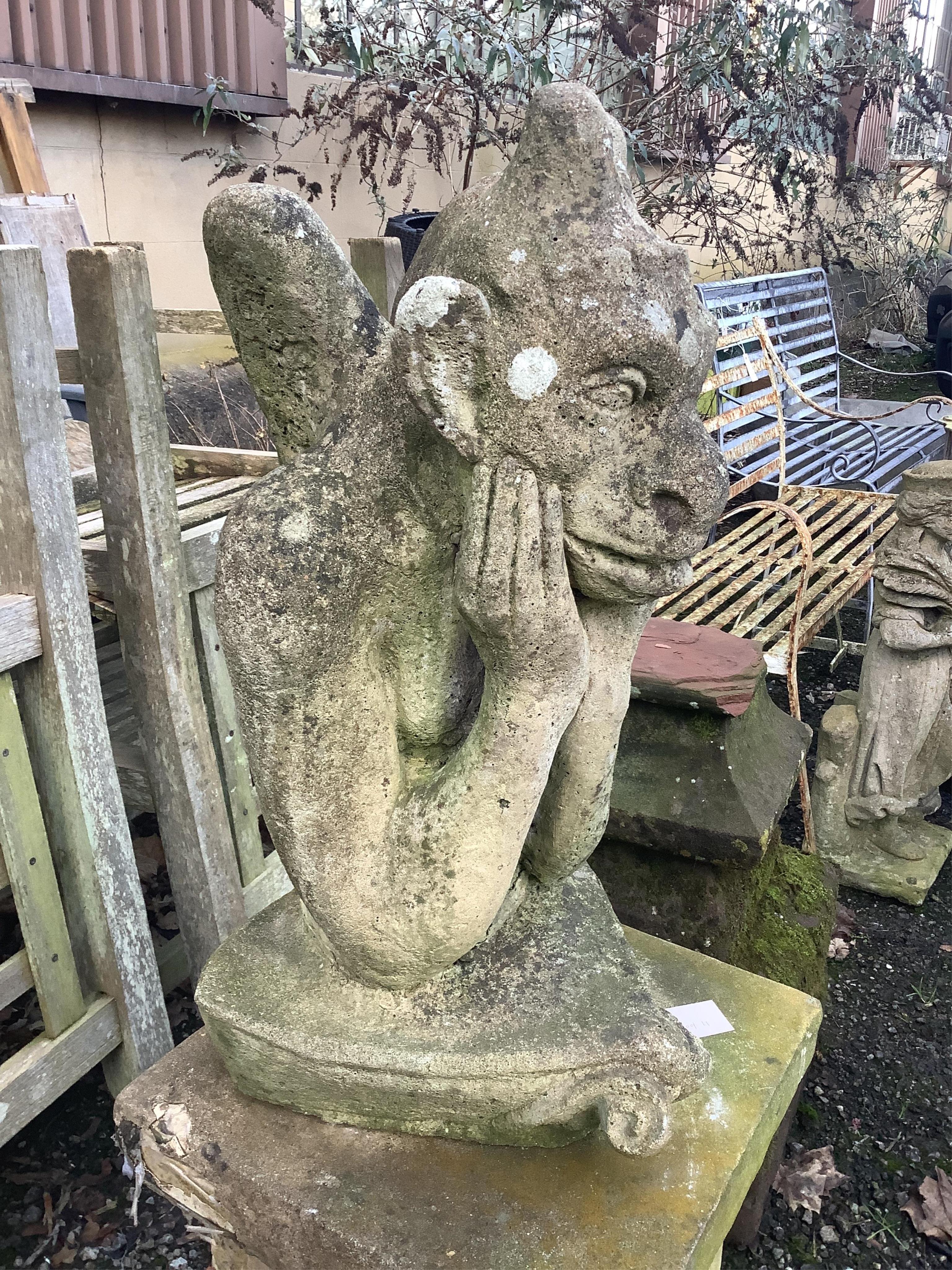 A reconstituted stone gargoyle ornament on square plinth, height 120cm. Condition - fair